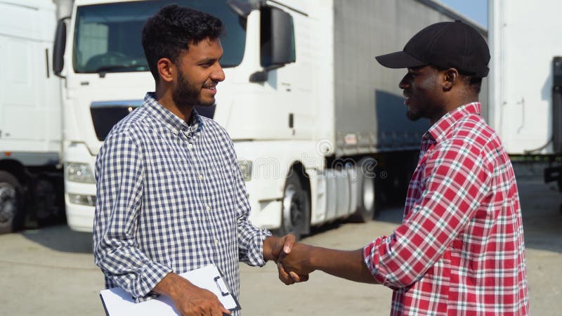 indian-manager-african-trucker-shaking-hands-truck-288903543