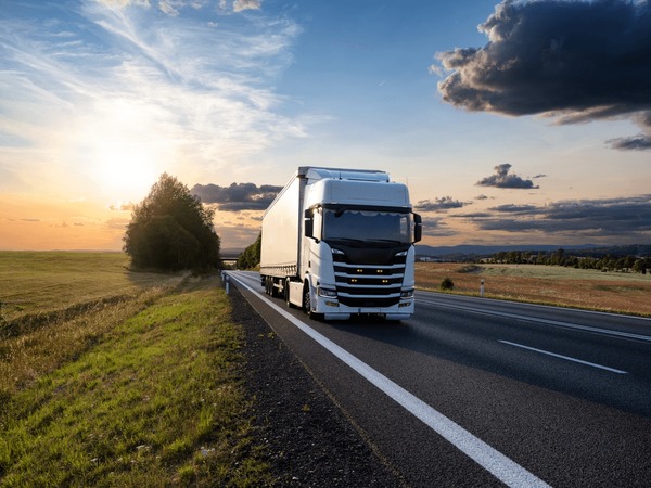 white-truck-driving-on-asphalt-600nw-2469501197